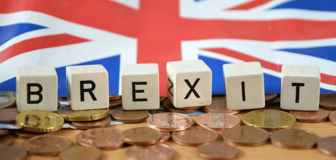 Union Jack flag and a row of Euro coins separated by a line of cubes spelling out BREXIT