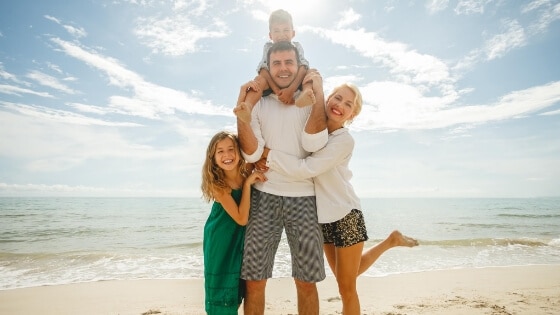 A family day out at the beach in summer