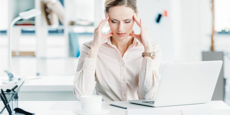 A woman takes a minute to relax, although seems stressed about the IR35 rule for contract workers