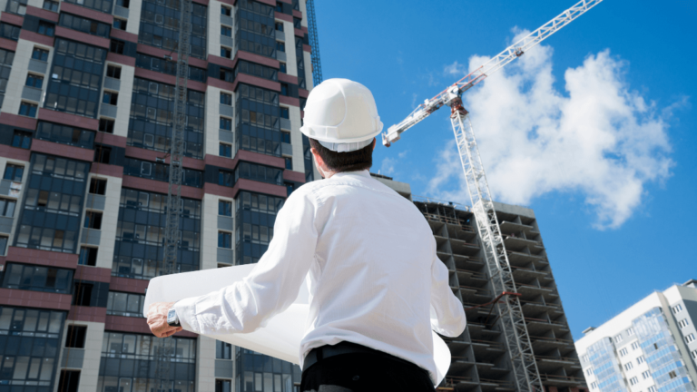 An Architect studying clouds as they pass a tall building