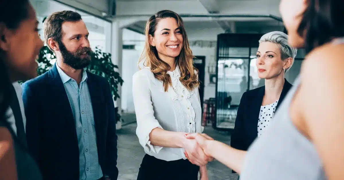 Female recruitment professional meets her business partners